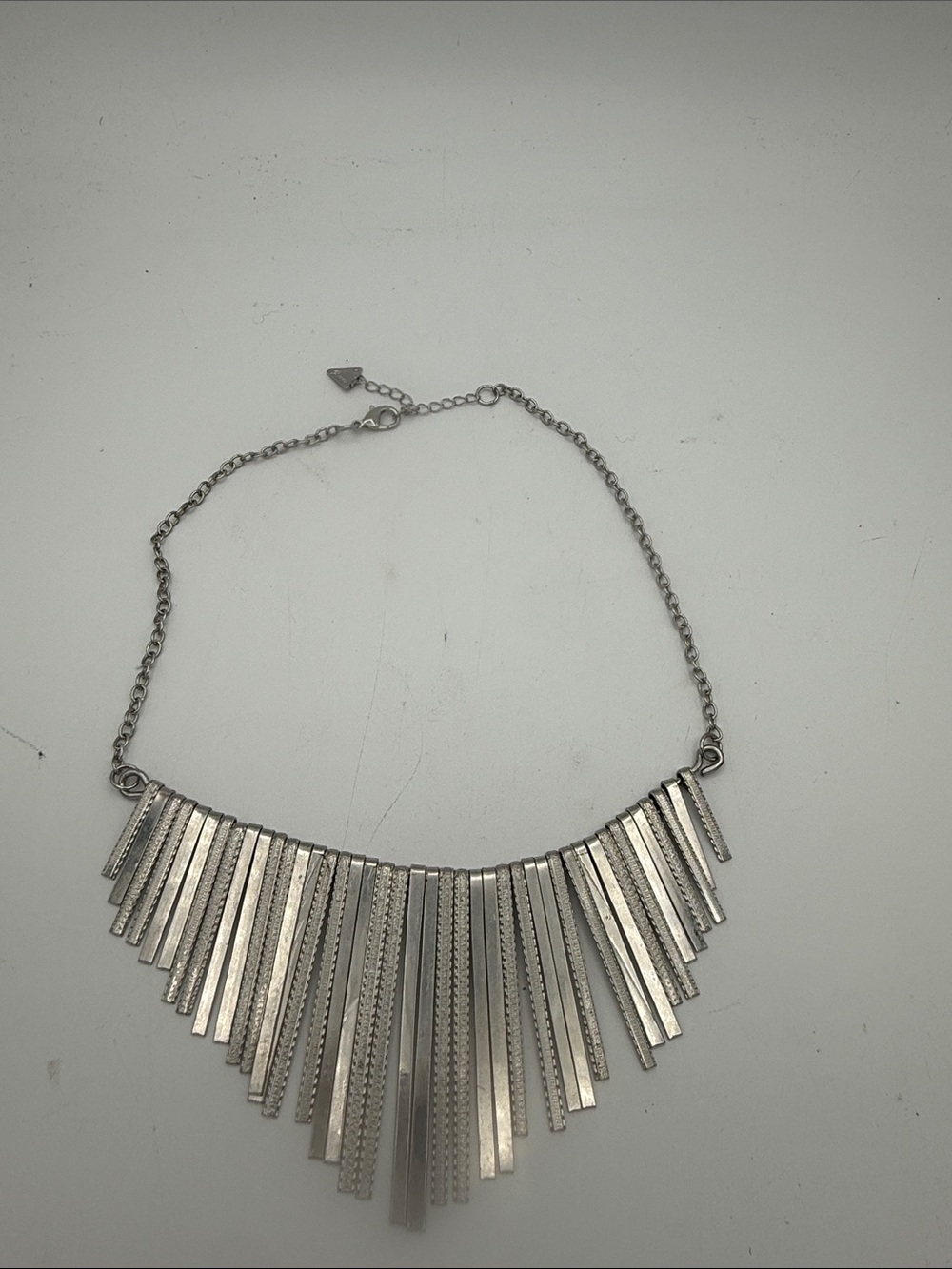 Guess women’s Silvertone Fringe Bar Statement bib Necklace